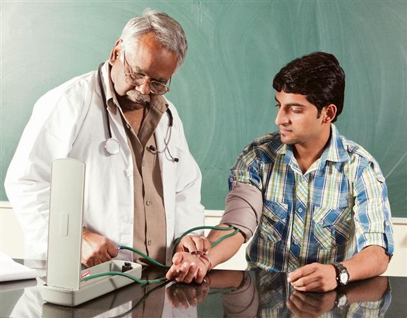 A doctor measuring a patient's blood pressure